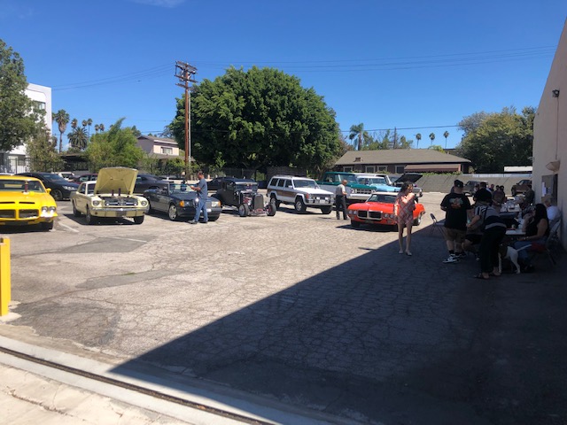crowd at the car show looking at cars